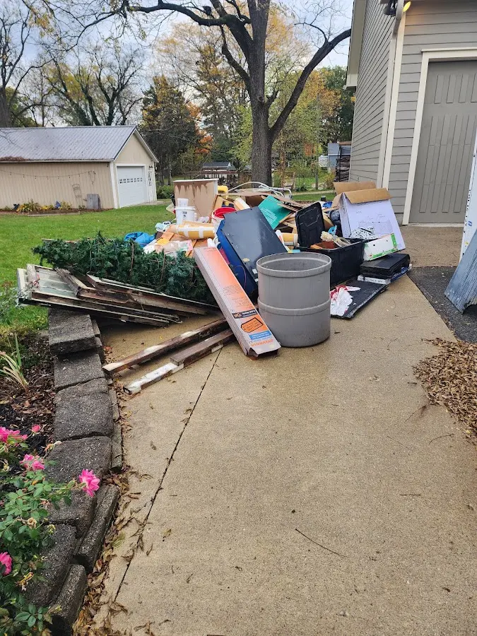 Dumpster being loaded with debris for 3 Yard Dumpster Rental in Breckenridge